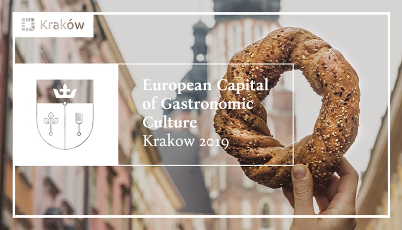 Foto dell'obwarzanek, tipica pagnotta della città di Cracovia. Scritta: "European Capital of Gastronomic Culture - Krakow 2019"